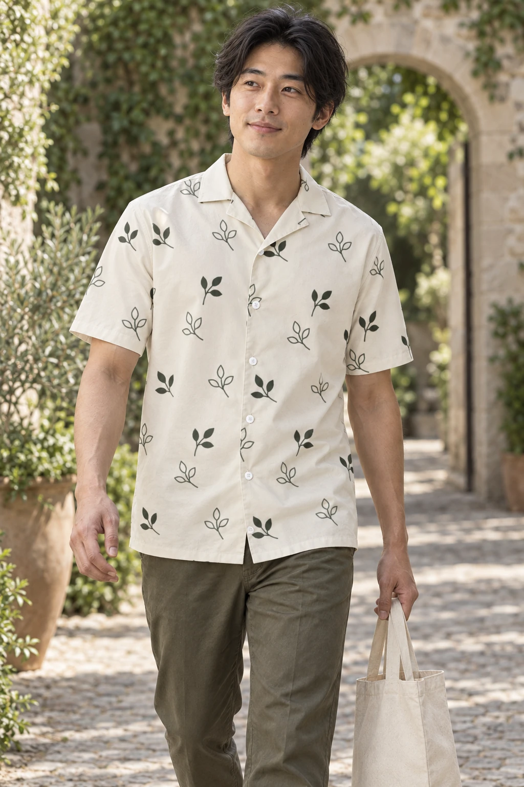 Open Grove in Oat, worn by a man with olive sprigs and white buttons.