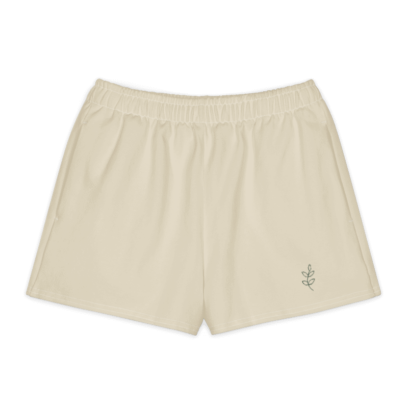 Quiet Stem Shorts in Sand / Olive, olive stem at the wearer’s left front leg.